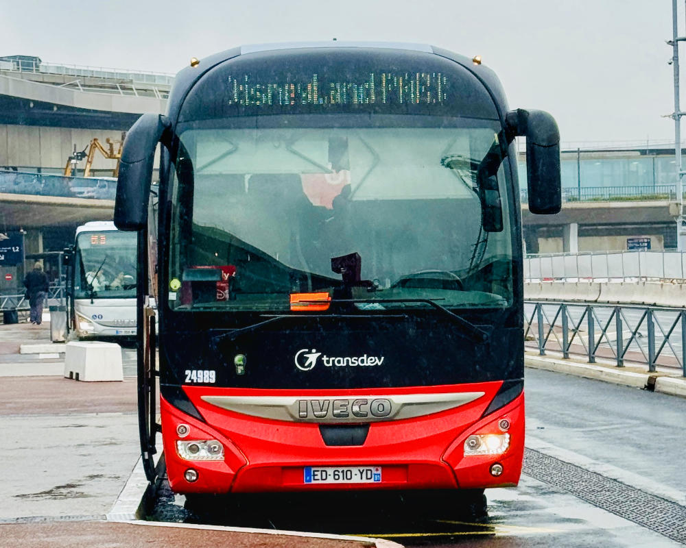 The front of the Magical Shuttle bus ready to depart for Disneyland Paris