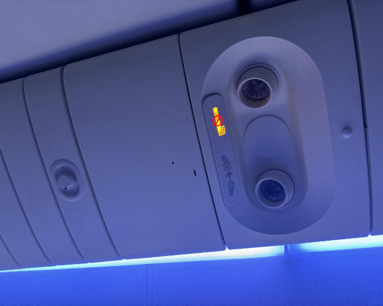 British Airways economy class cabin, showing there are no individual air vents above the seats
